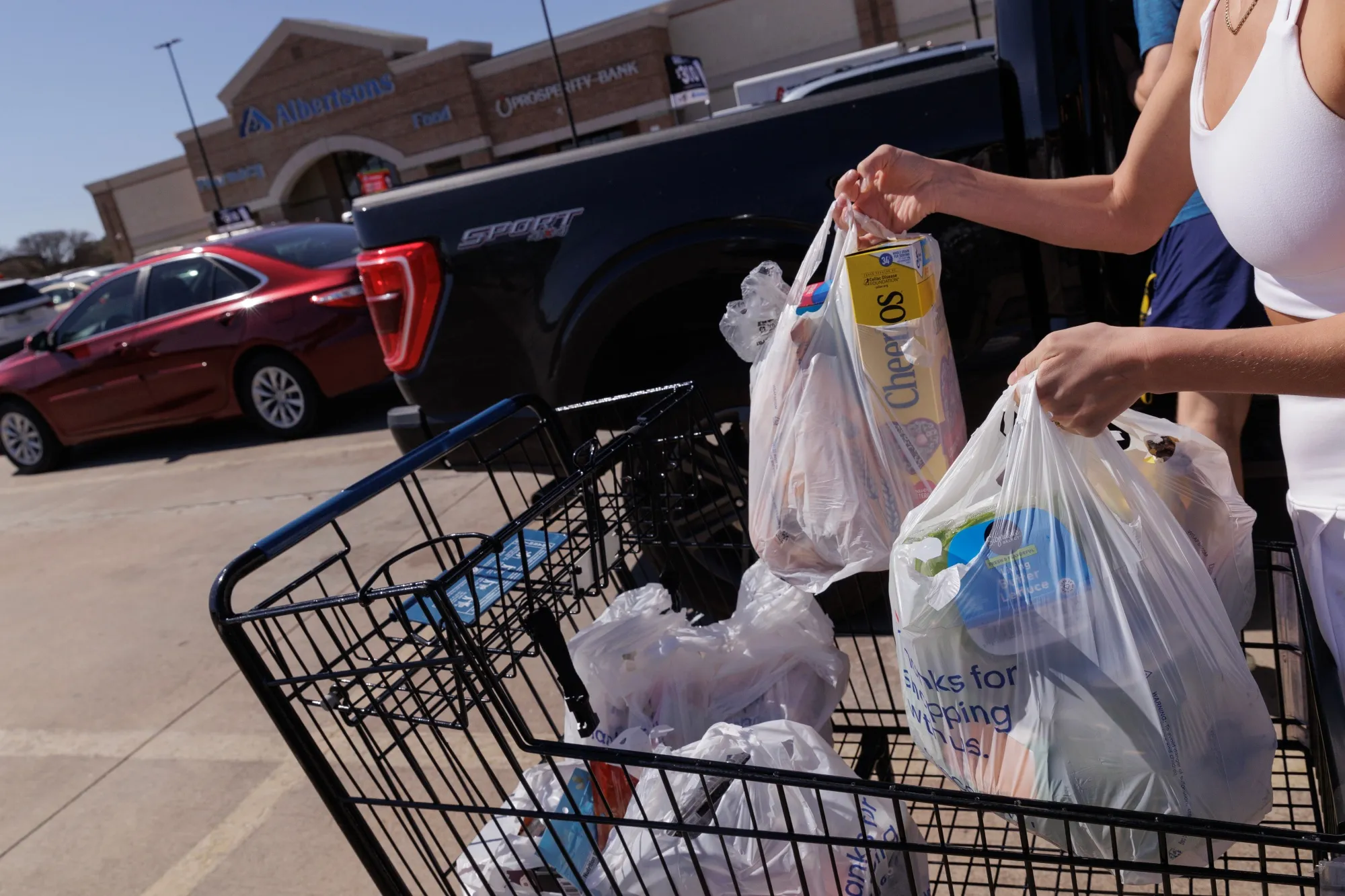 A shopper outside an Albertsons grocery store in Grand Prairie, Texas.
