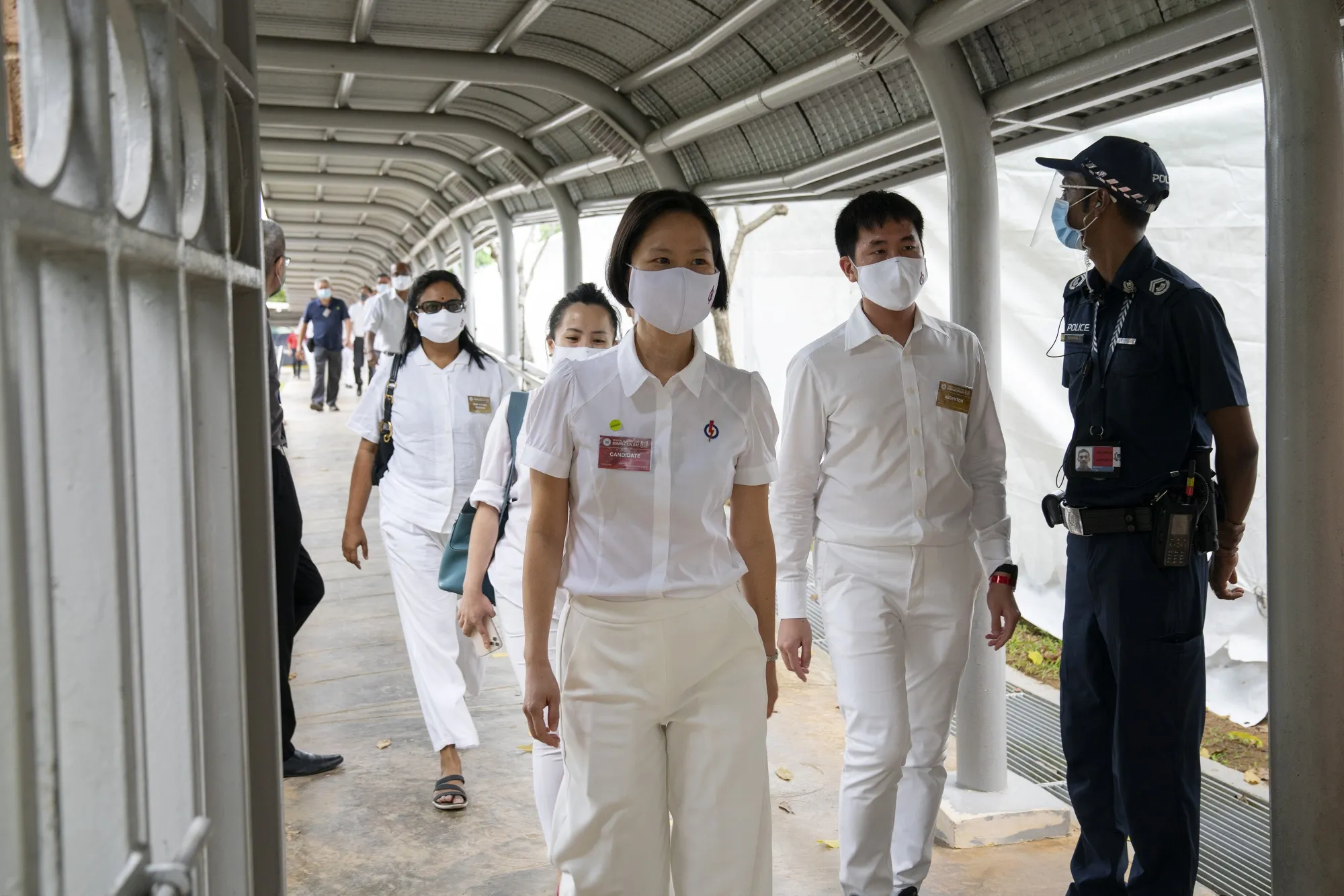 Gan Siow Huang, member of the Peoples Action Party, center, leaves a nomination center&nbsp;in Singapore, on&nbsp;June 30.