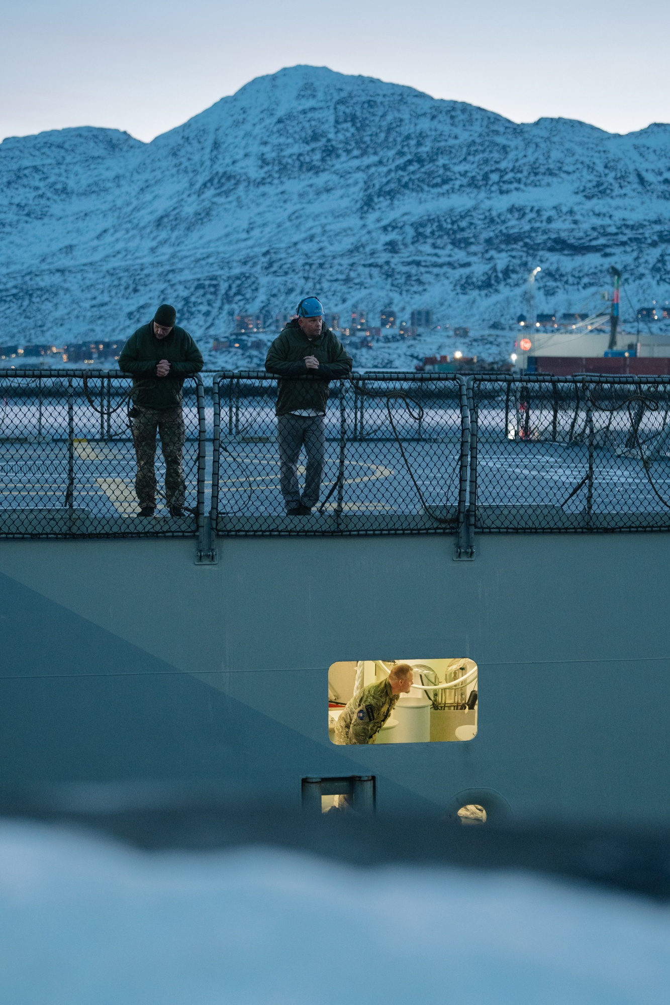 Sailors aboard a Royal Danish Navy offshore patrol vessel in the harbor in Nuuk, Greenland, on Thursday, Jan. 29, 2026. Greenland is warming fast, and its massive ice sheet contains enough fresh water to raise global sea levels by 23 feet. Photographer: Juliette Pavy/Bloomberg