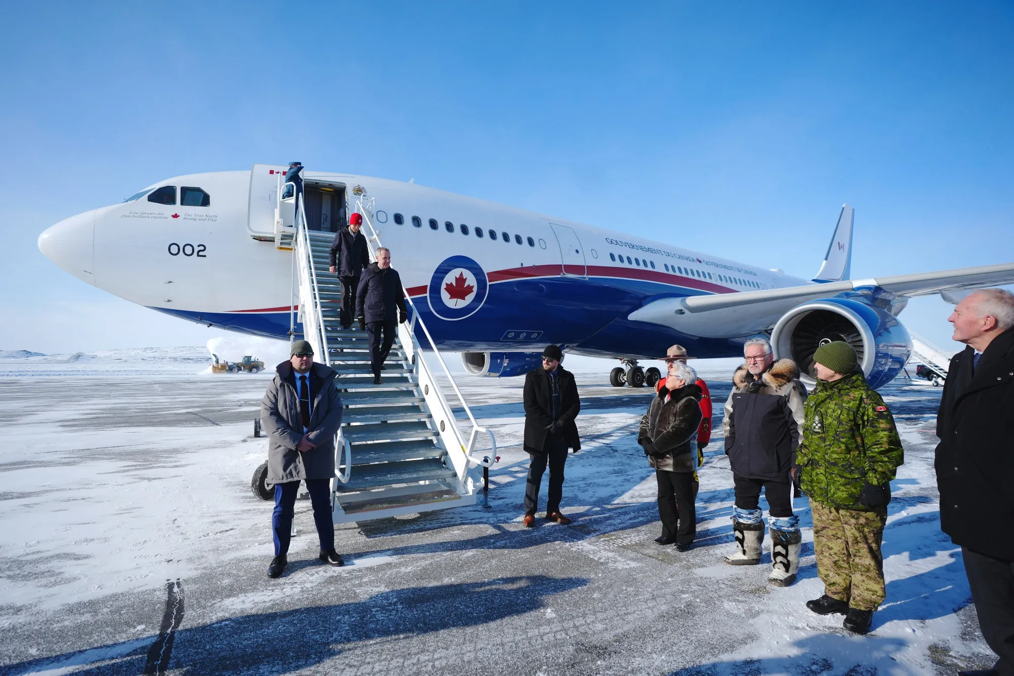 Mark Carney and his wife, Diana Fox Carney, arrive in Iqaluit, Nunavut, on March 18.