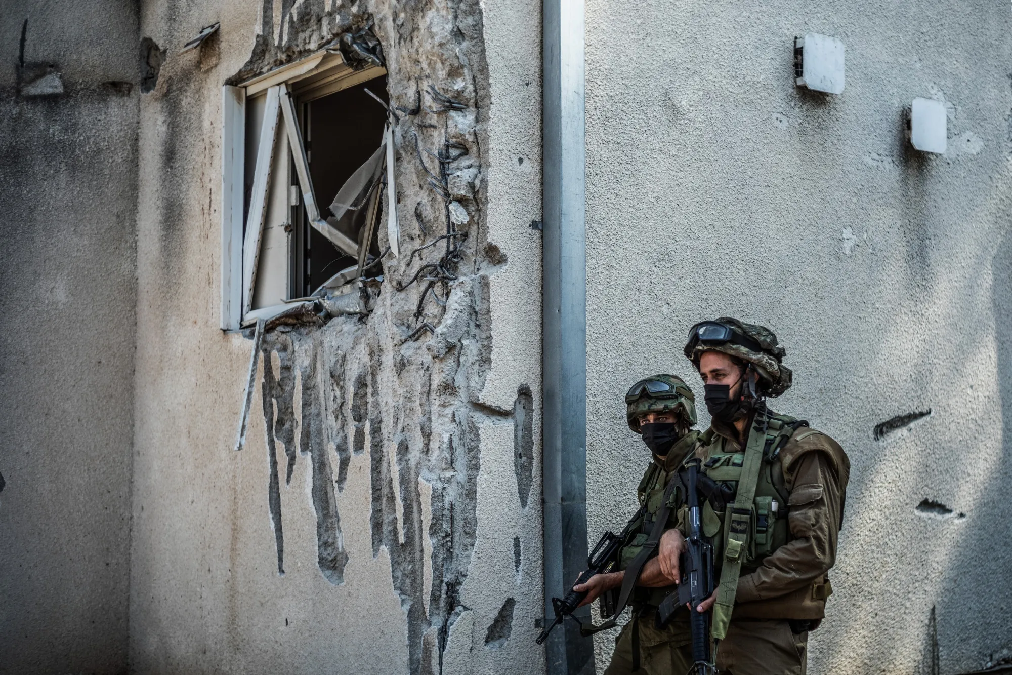 Israeli soldiers scan the area surrounding Kfar Azza, Israel.