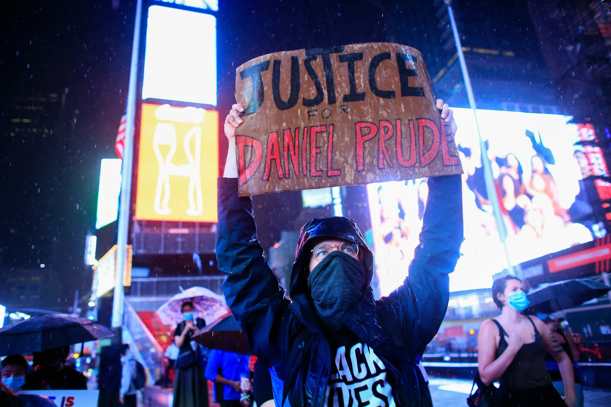 A demonstrator holds a sign during a protest to demand justice for Daniel Prude, on September 3, 2020 in New York City.