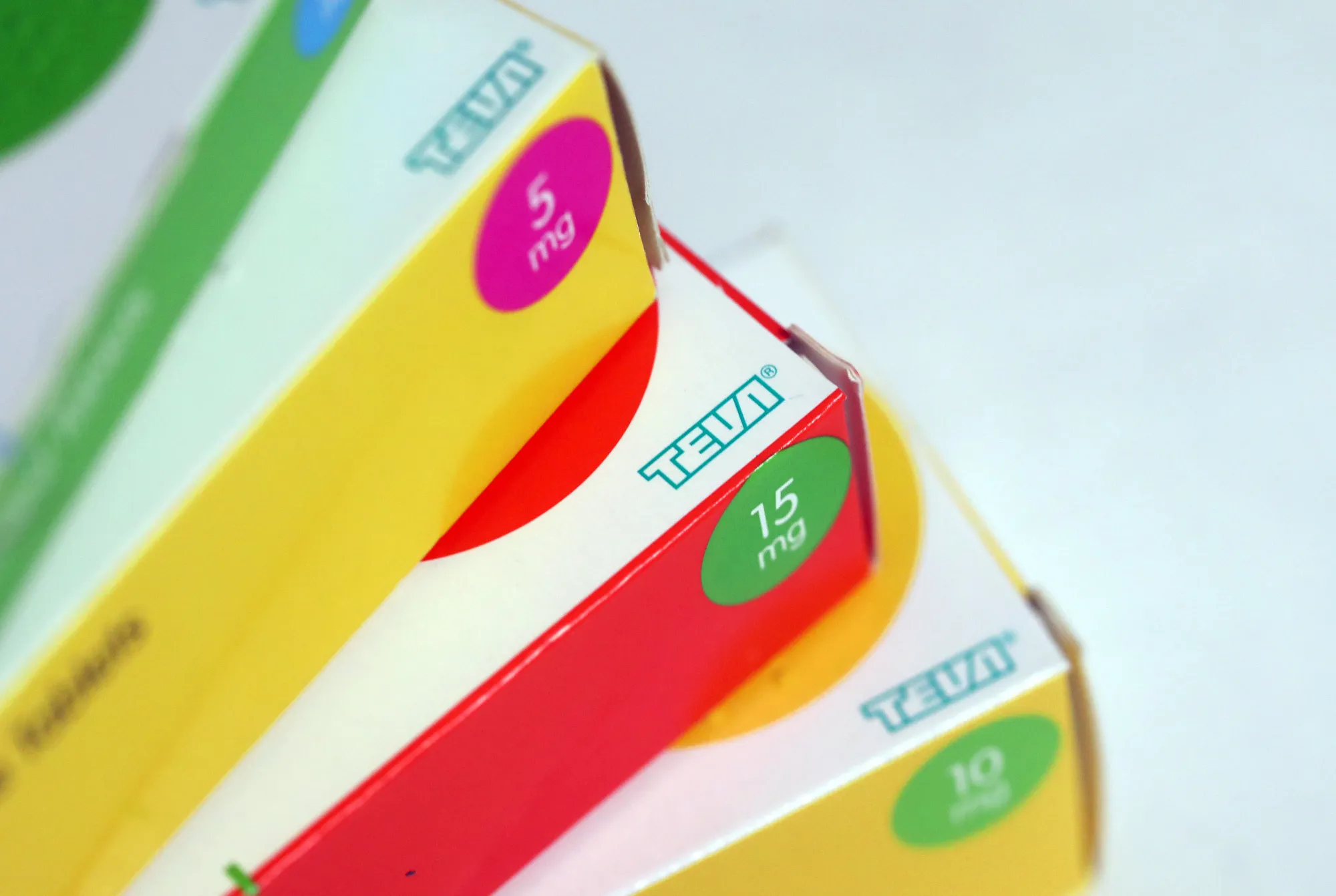 Boxes of tablets, produced by Teva Pharmaceutical Industries Ltd., sit on a pharmacy counter in this arranged photograph in London, U.K., on Thursday, Dec. 29, 2016. The rapid pace of innovation among drugmakers may continue to be overshadowed by broader investment themes, such as the switch away from defensive stocks into more cyclical industries, during 2017, according to Bloomberg Intelligence.