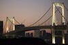 The Rainbow Bridge stands illuminated at dusk in Tokyo, Japan, on Monday, Nov. 6, 2017. The Japanese Cabinet Office is scheduled to release third-quarter gross domestic product (GDP) data on Nov. 15, 2017.