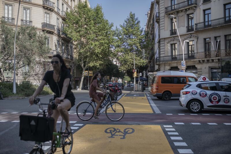 Cyclists use bike lanes in Barcelona in 2020. The pandemic sharpened the global appetite for more walkable and bike-able neighborhoods. 