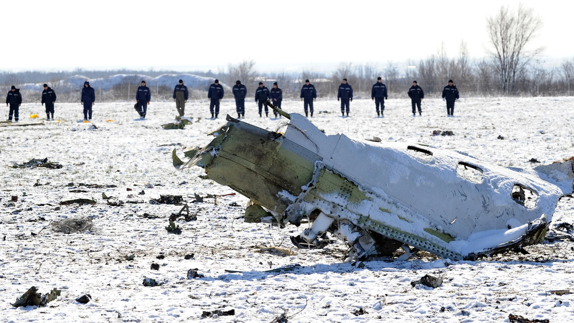 Russian Emergency Ministry rescuers search the wreckage of a crashed airplane at the Rostov-on-Don airport on March 20, 2016.
