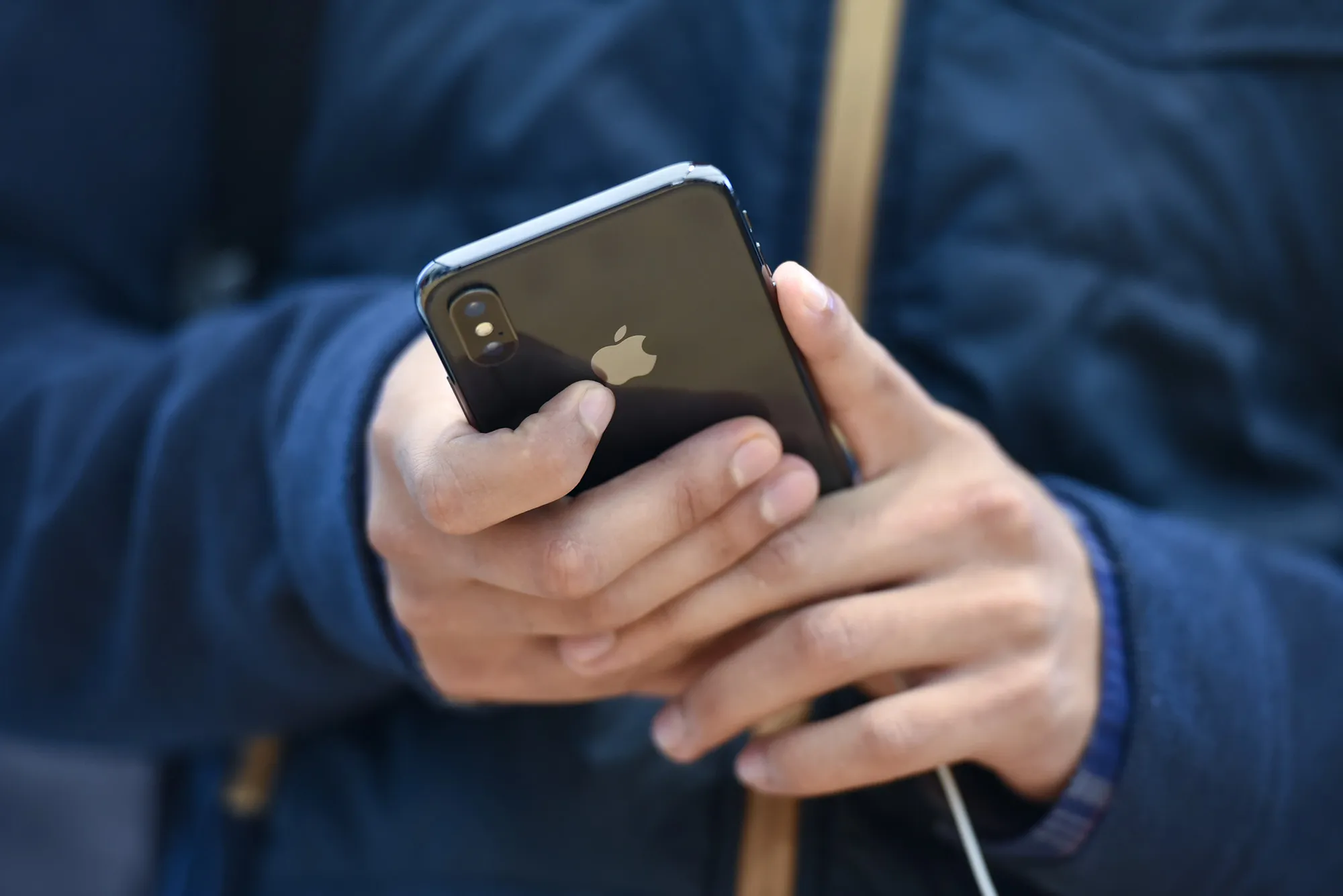A customer views an Apple iPhone X.