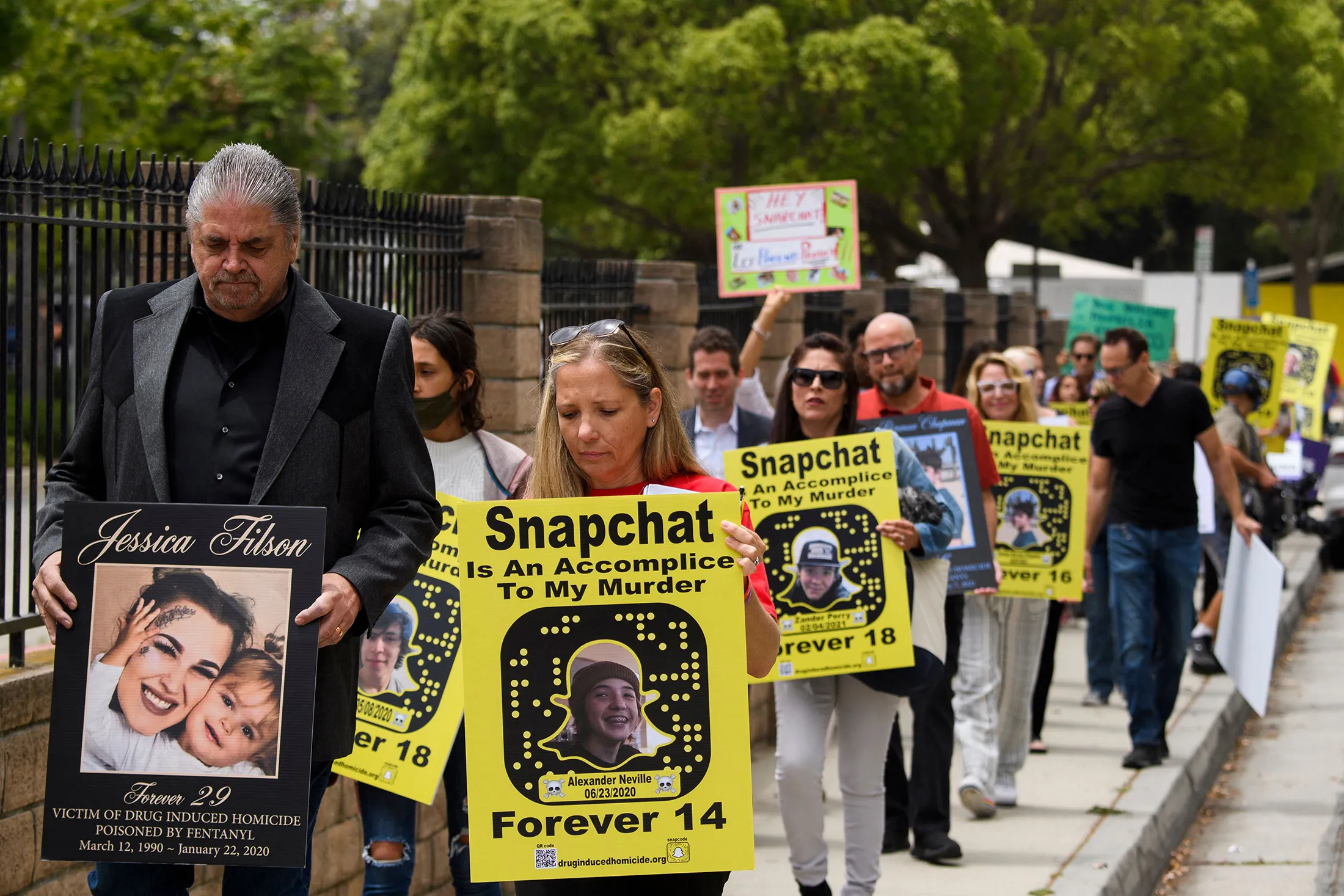 Demonstrators march outside Snap headquarters in Santa Monica, California, in June 2021.