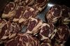 Rib-eye cuts of beef sit stacked for packaging in Ohio.