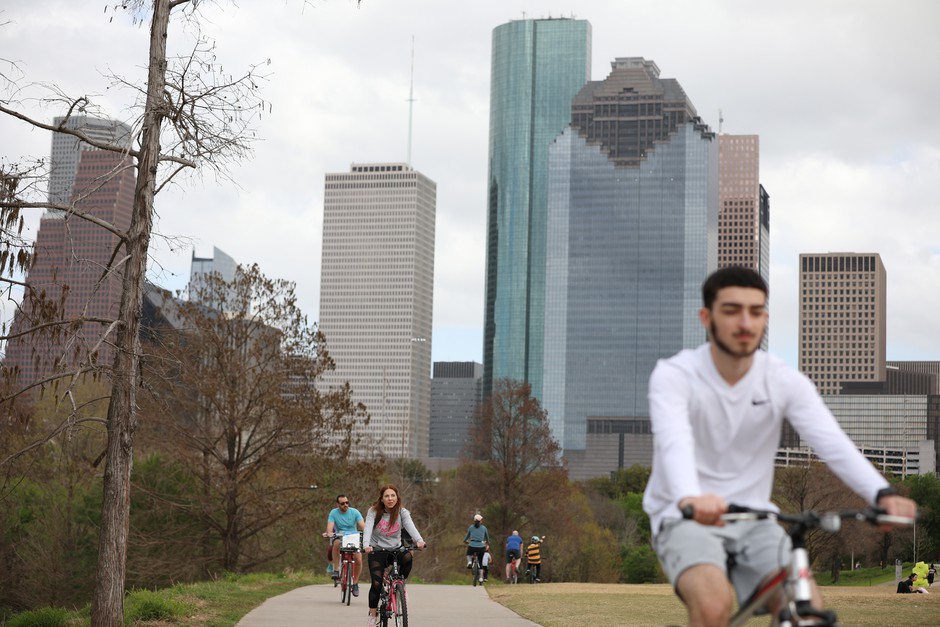 Cyclists in Buffalo Bayou Park in downtown Houston. The Texas city has recently adopted an ambitious climate and mass transit plan.