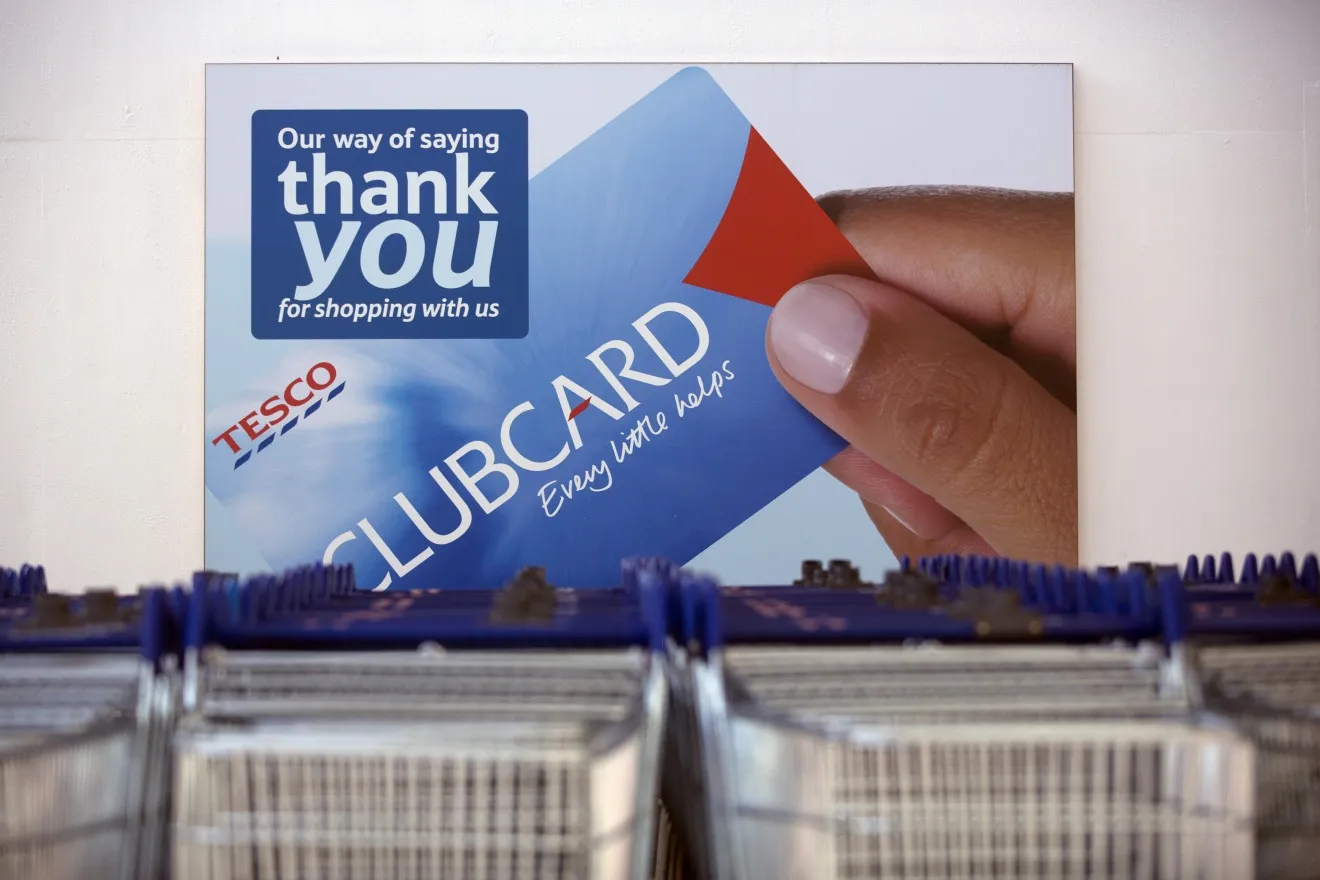 A&nbsp;poster for Tesco Plc's Clubcard rewards program outside a supermarket in London.&nbsp;