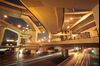 Traffic moves on a highway overpass near buildings in downtown Shanghai, China.