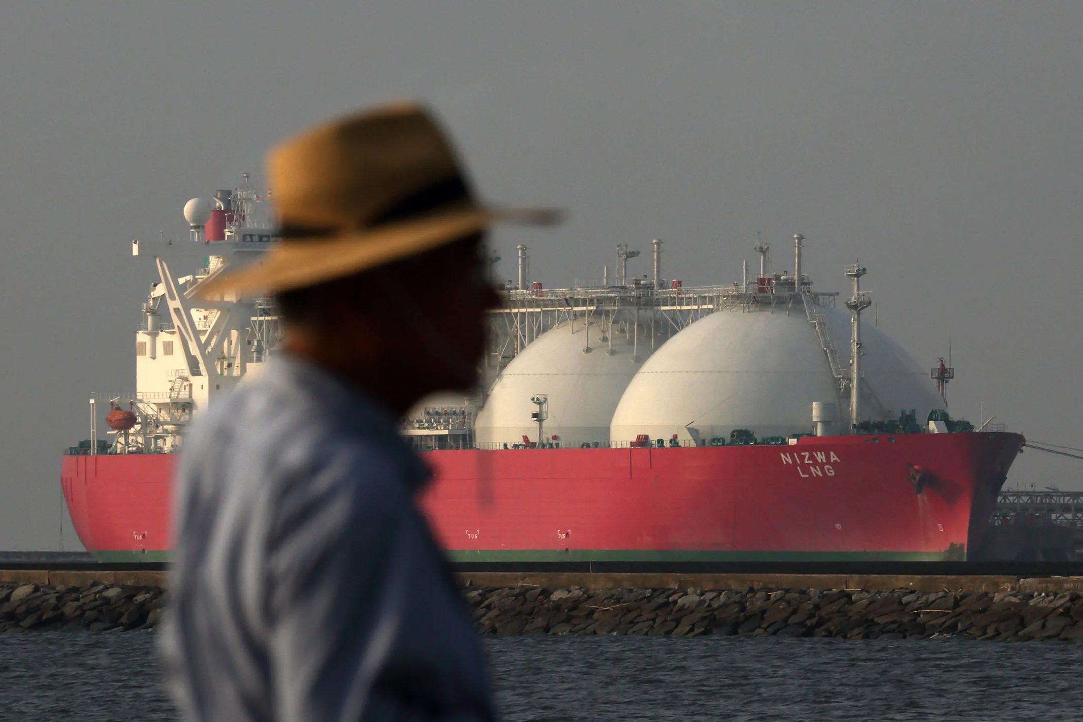 A liquefied natural gas (LNG) tanker berthed at a power plant in Japan.
