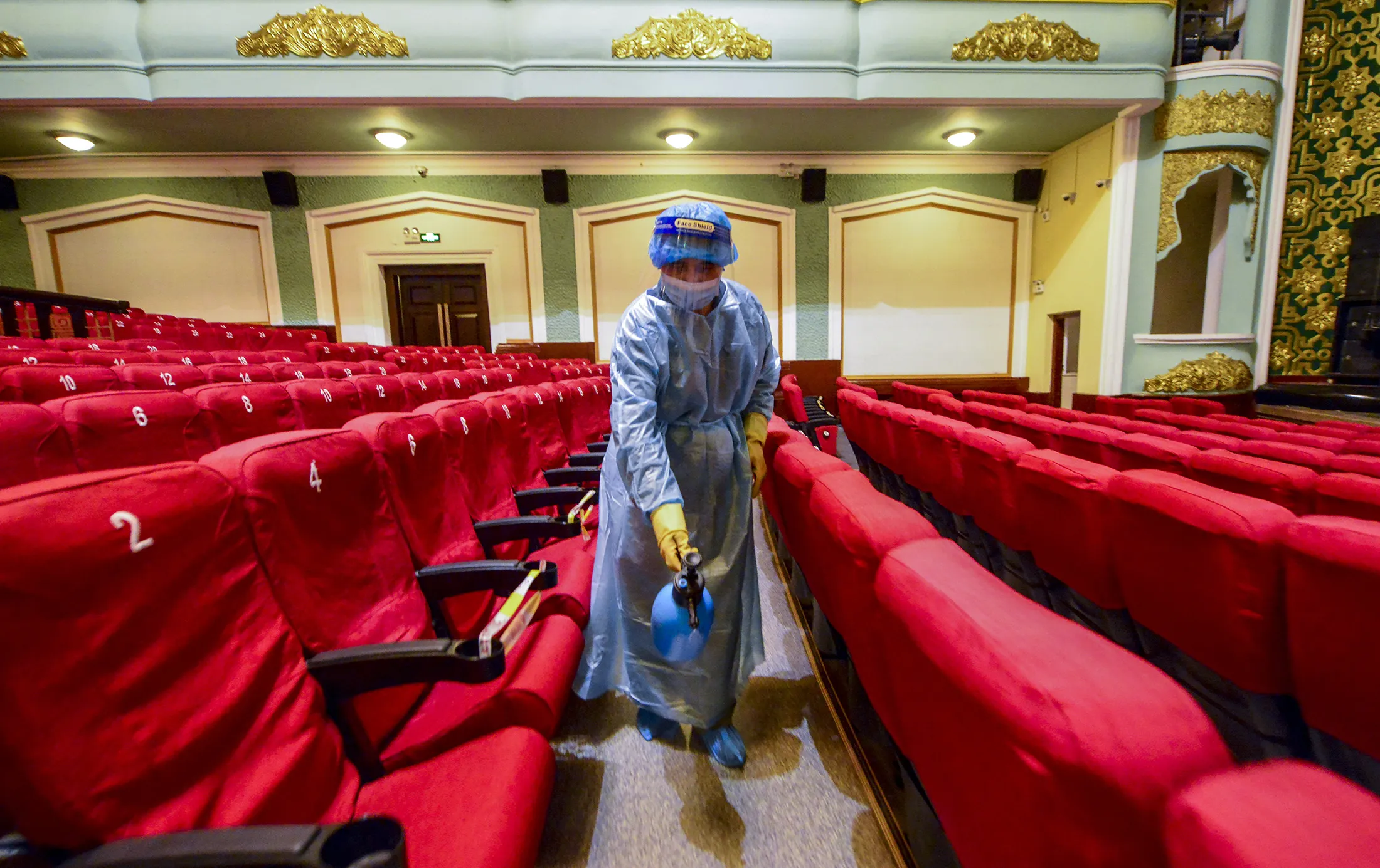 A worker sprays disinfectant at a cinema in Urumqi, Xinjiang, earlier in August.