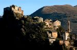 Buildings are nestled into the mountainside in the town of Corte, northern Corsica