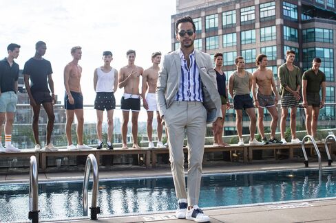 Moti visits a Katama launch event on opening night of New York Fashion Week: Men’s at Jimmy at the James Hotel. Khaki suit by Theory, shirt by Bonobos, leather sneakers by Valentino, sunglasses by Garrett Leight (seen in all).