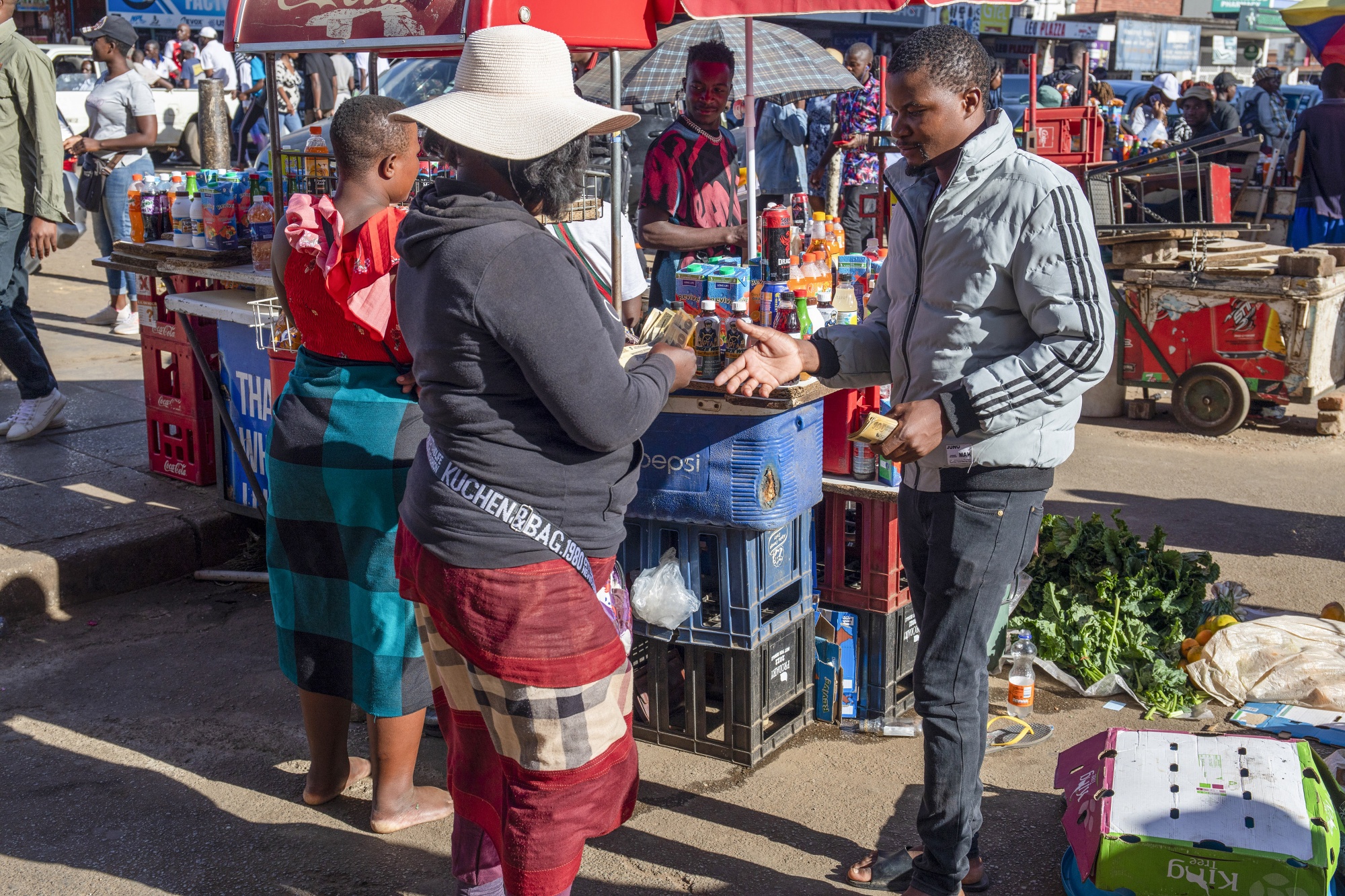 A customer pays for goods in Harare, Zimbabwe.&nbsp;