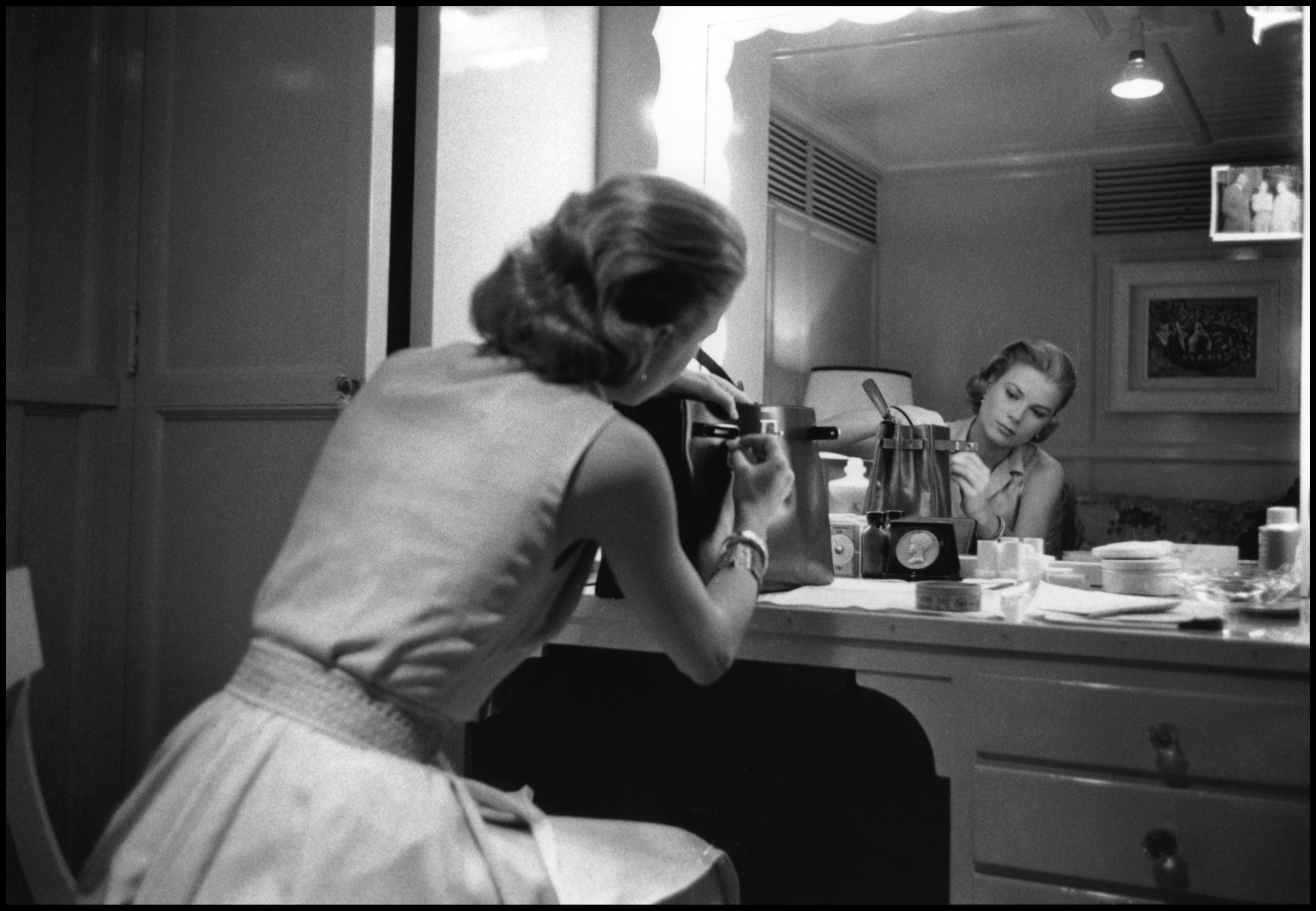 Grace Kelly in her dressing room with the bag named after her, on the set of “High Society” in 1956.Photographer: Dennis Stock/Magnum Photos