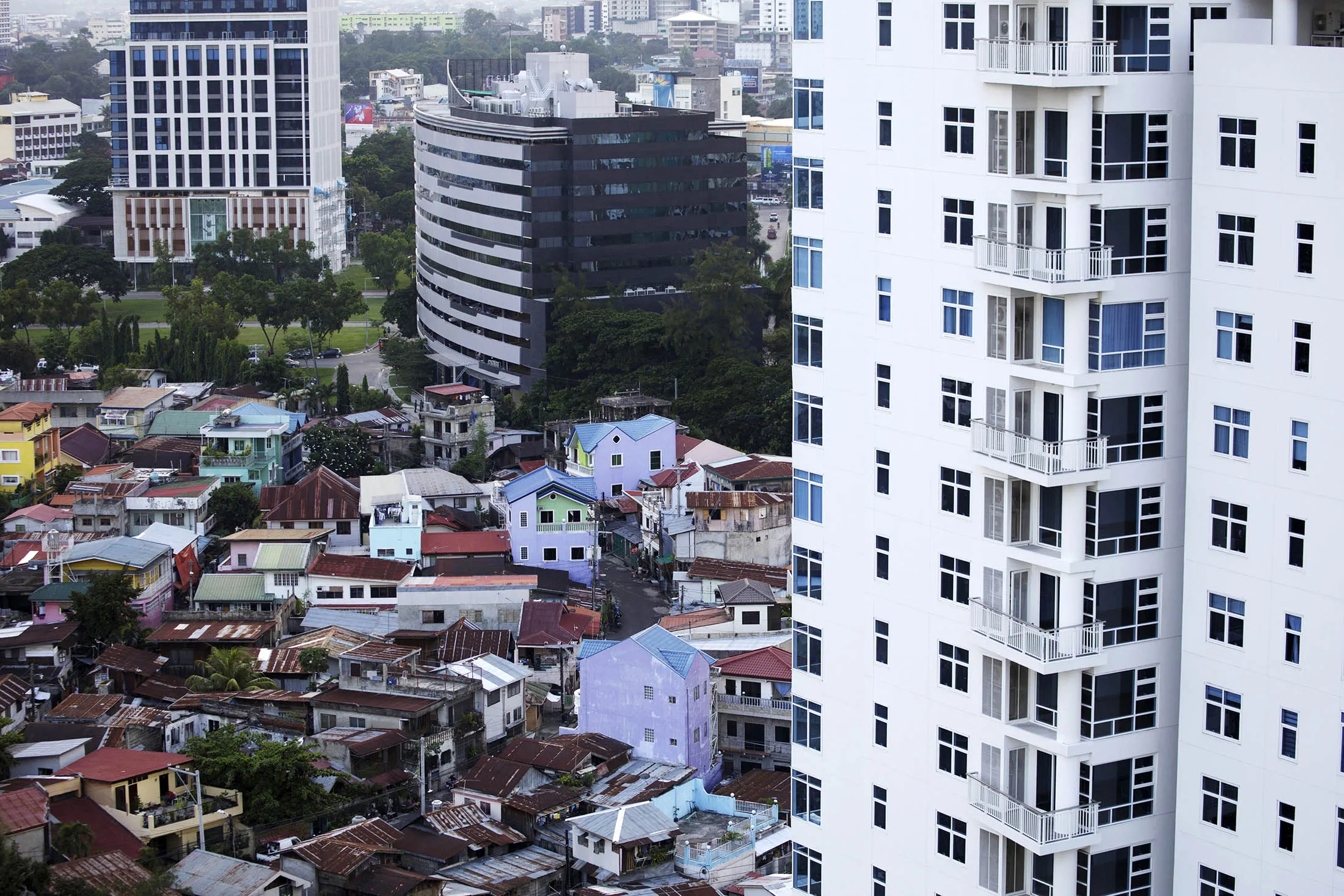 Slums next to residential buildings in Cebu, Philippines.
