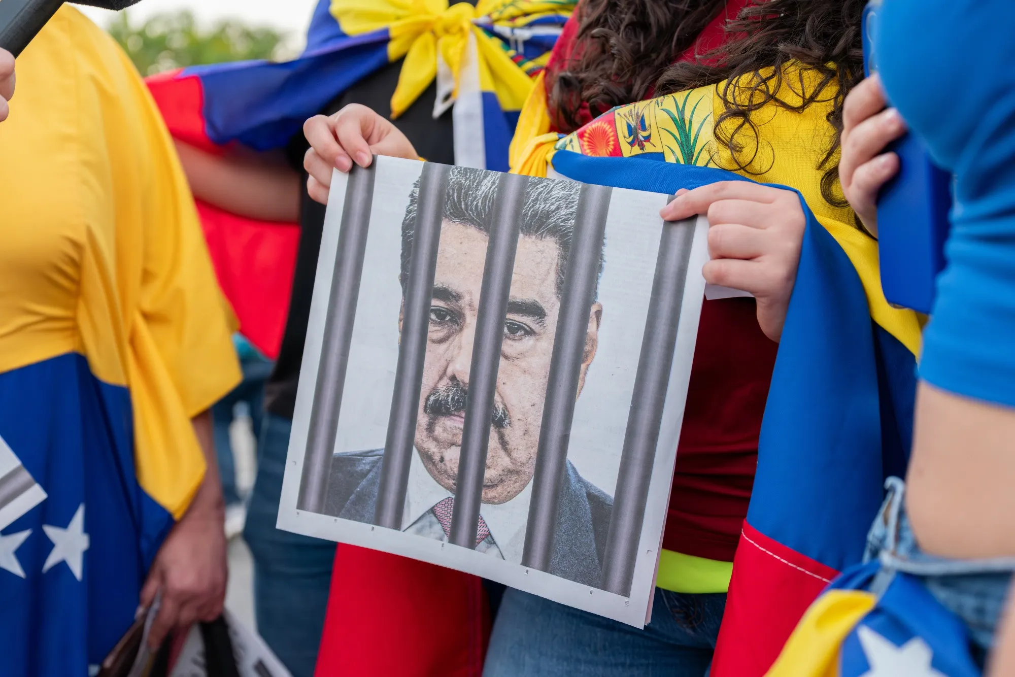 A resident holds a newspaper with news about ousted Venezuelan President Nicolas Maduro during a celebration&nbsp;in Florida, US.