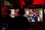 An attendee plays the Spider-Man video game during the Sony Playstation event ahead of E3 in 2018. 