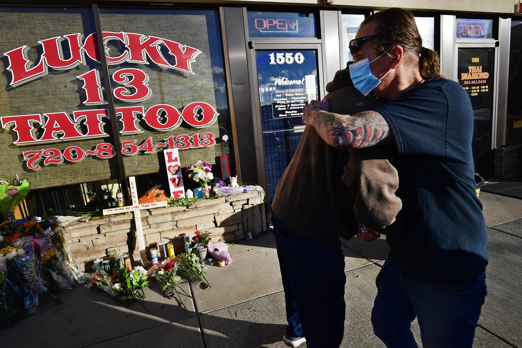 Lucky Tattoo&nbsp;13 owner Joey Black, right, outside his shop, where Danny Scofield was killed, in Lakewood, Colorado, on Dec. 29.