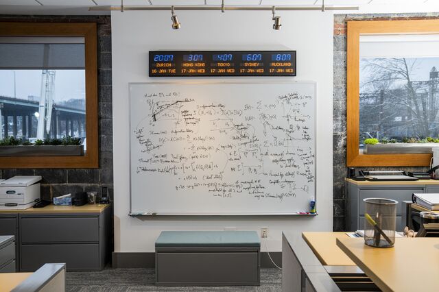 A white board with an equation written on it at the Fermat Capital Management office.