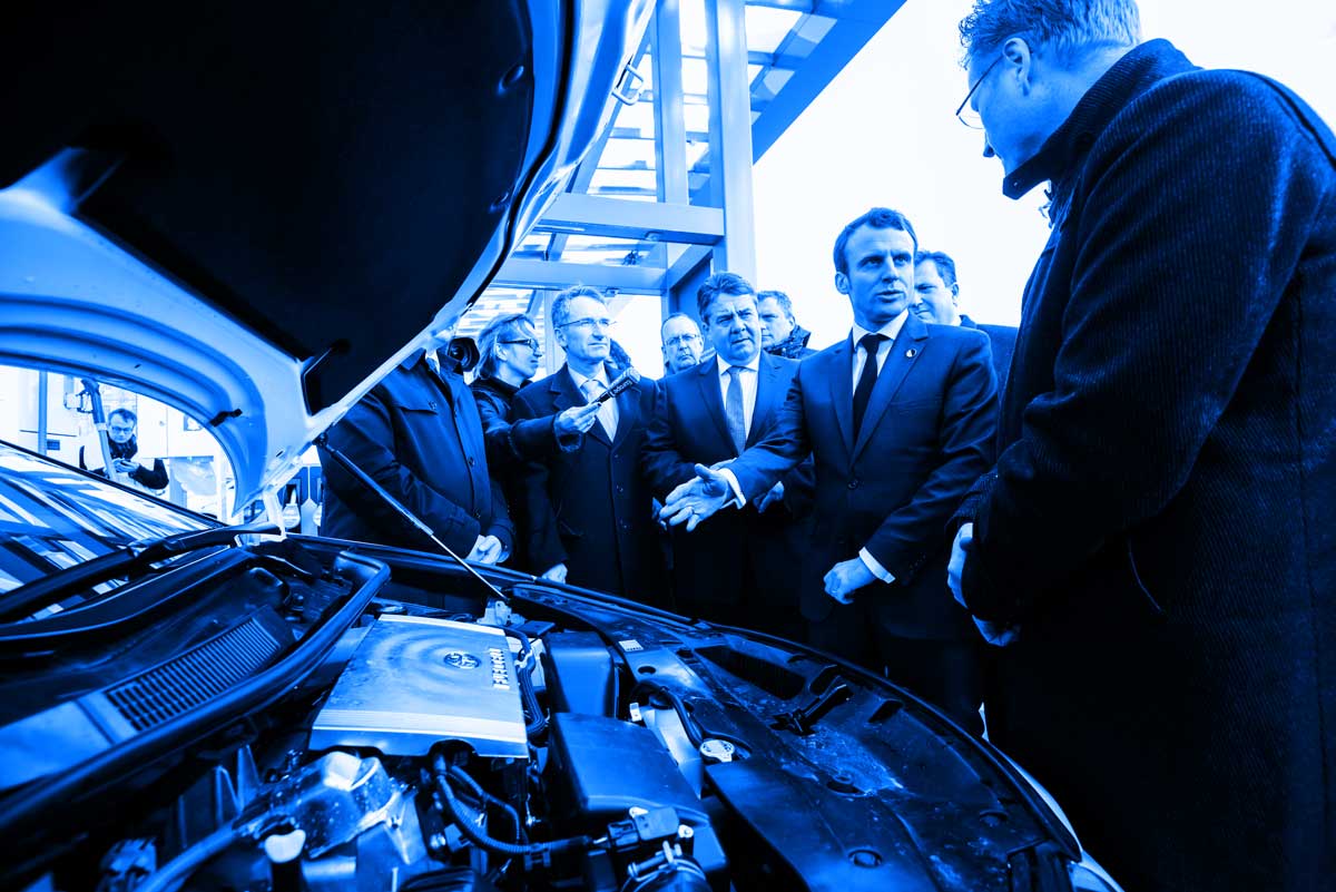 German Vice Chancellor and Economy and Energy Minister Sigmar Gabriel and French Economy and Industry Minister Emmanuel Macron have a look at a hydrogen fuel cell car during a photo option on the occasion of the Clean-Energy-Partnership following a Franco-German Inter-Ministerial meeting in Berlin on March 31, 2015.