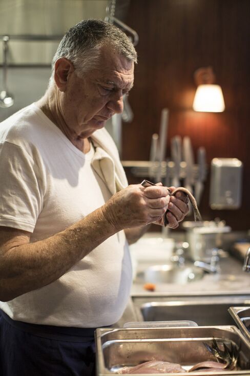 Chef Yossi Elad, who is known as Papi, preparing sardines.