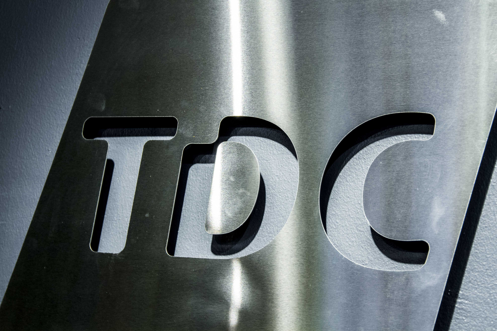 TDC Faces Junk Rating as Bidders Reveal New Debt Structure - Bloomberg