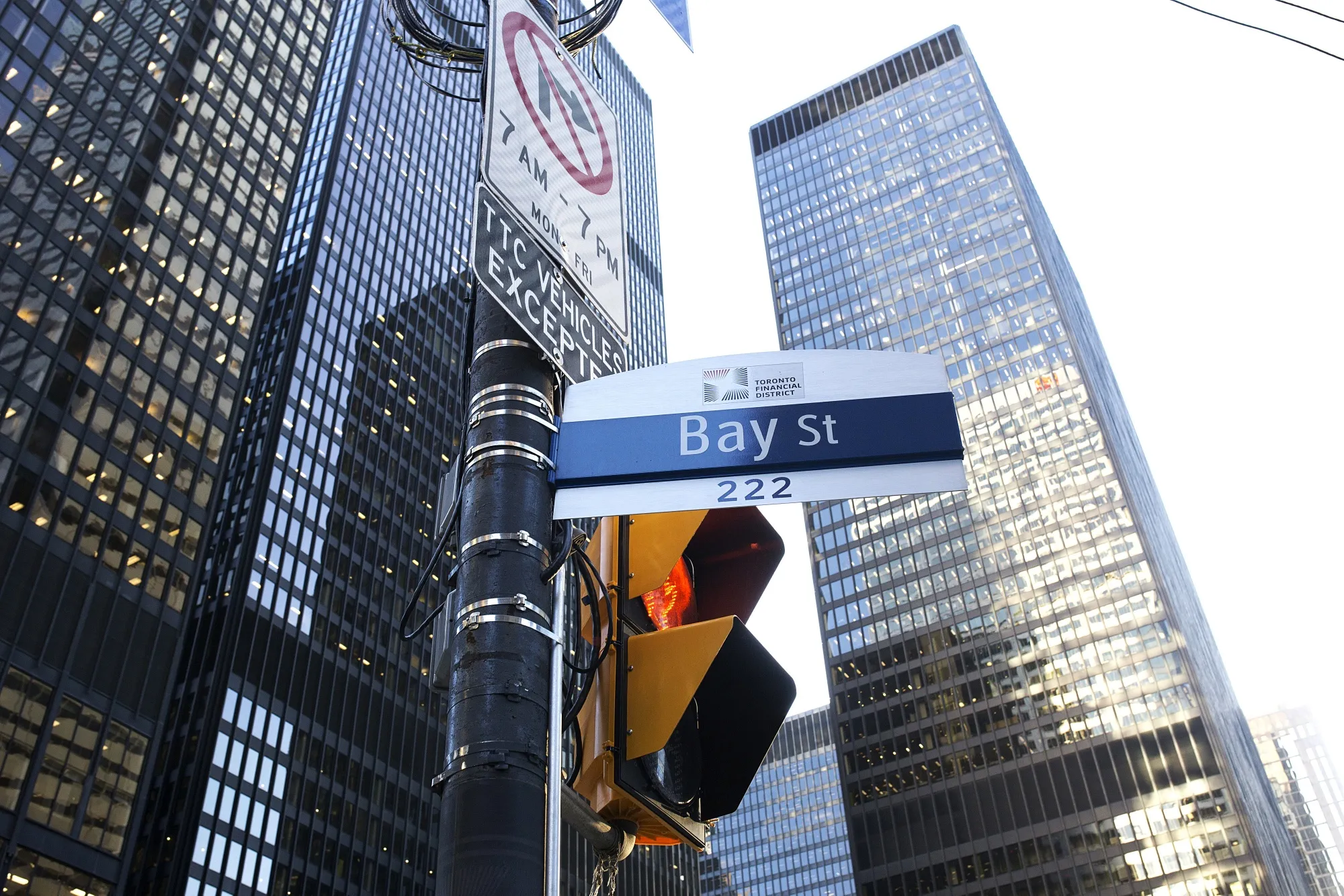 A "Bay Street" sign is displayed in the financial district of Toronto, Ontario, Canada, on Friday, Feb. 21, 2020. Canadian stocks declined with global markets, as authorities struggled to keep the coronavirus from spreading more widely outside China. However, investors flocking to safe havens such as gold offset the sell-off in Canada's stock market.