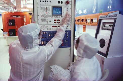 Workers at an Intel Semiconductor Plant