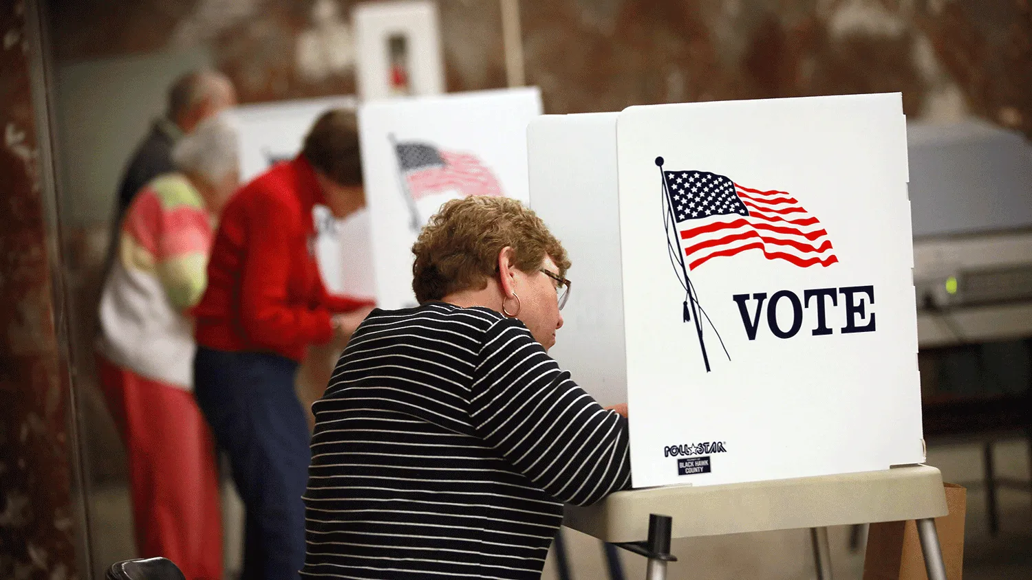 Residents fill in their ballots during early voting at the Black Hawk County Courthouse on September 27, 2012 in Waterloo, Iowa. Early voting starts today in Iowa where in the 2008 election 36 percent of voters cast an early ballot.
