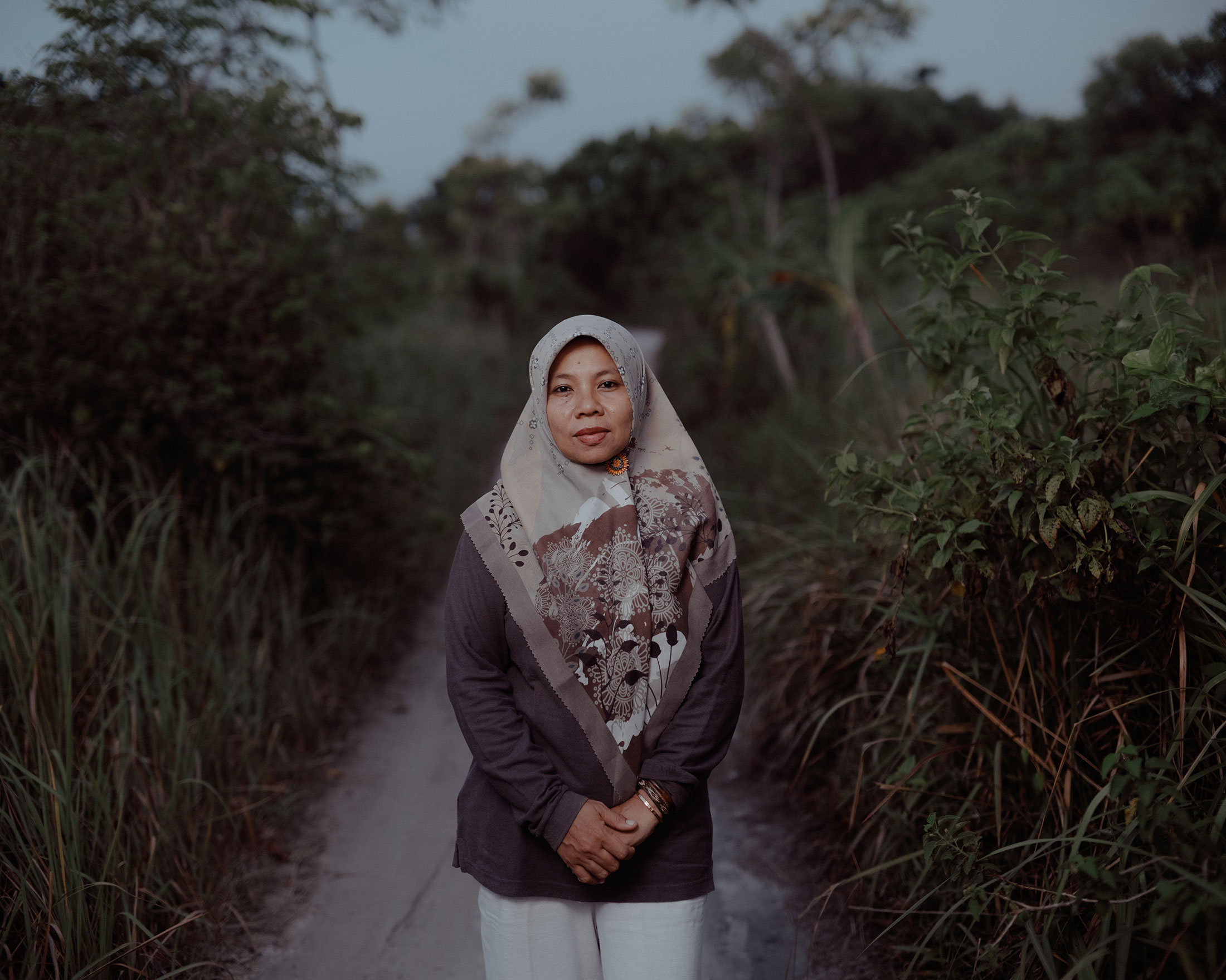 Asmania, one of the plaintiffs in the suit against the cement giant Holcim, is a fisher, shopkeeper and homestay operator — and now a community organizer — on Pari Island. Photographer: Muhammad Fadli