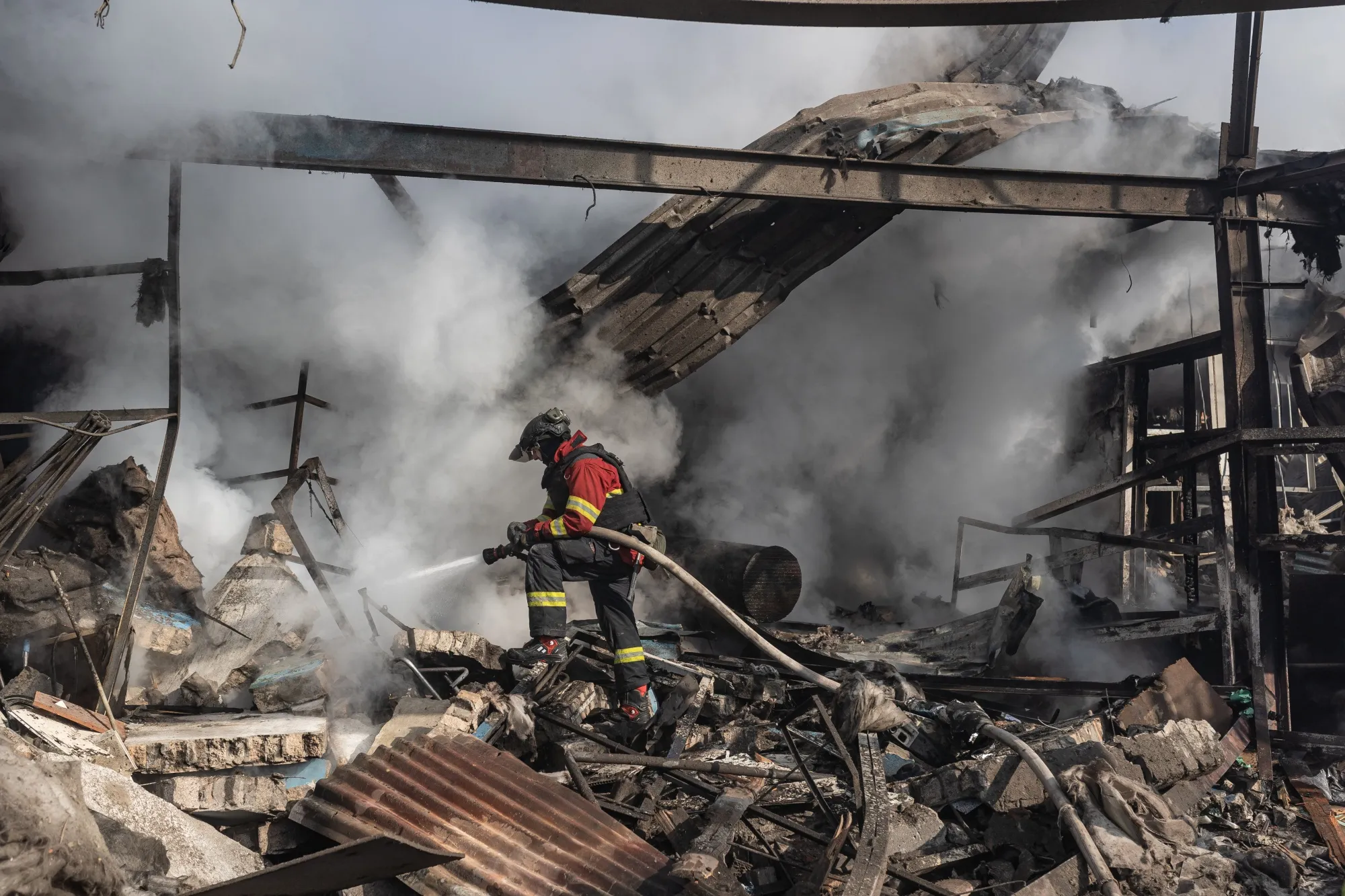 Ukrainian firefighters work to extinguish a fire&nbsp;following Russian shelling in&nbsp;Kostiantynivka, Ukraine, on Feb. 21.&nbsp;