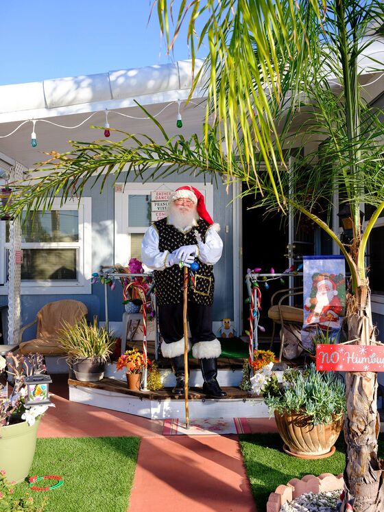 It’s Masks and Plexiglass for Mall Santas Trying to Lure Family Shoppers