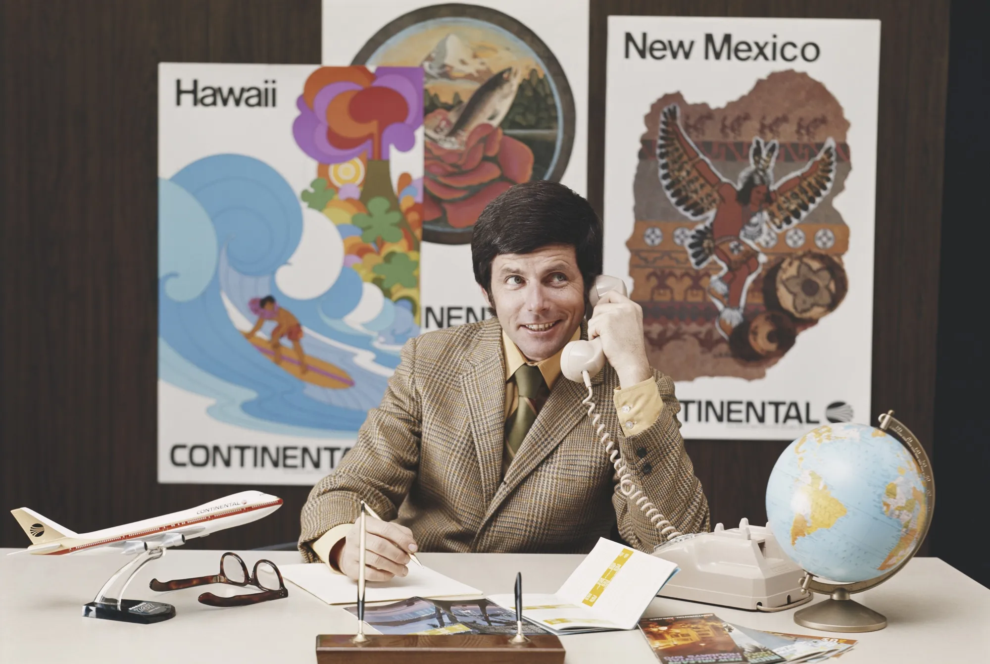 Travel agent talking on phone