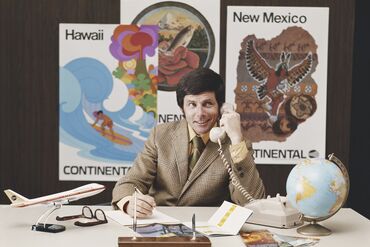 Travel agent talking on phone