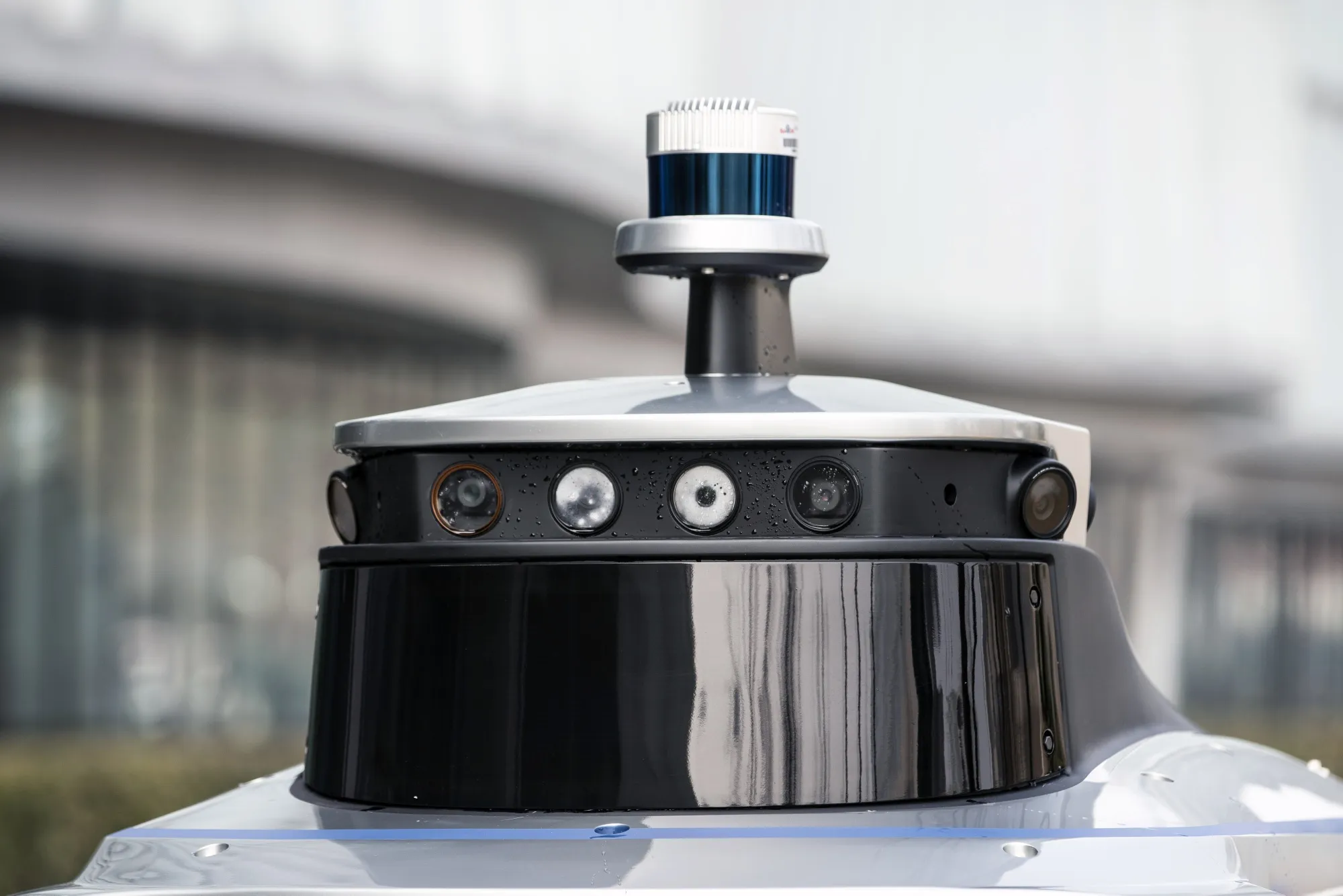 Cameras and sensors mounted on a Lincoln MKZ vehicle equipped with Baidu's Apollo autonomous driving platform.