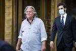 Steve Bannon, former U.S. President Donald Trump political strategist, left, departs from federal court in New York, U.S., on Thursday, Aug. 20, 2020.