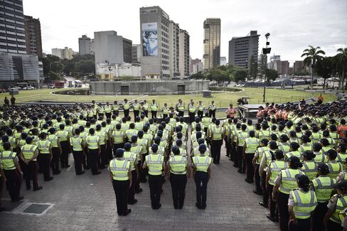 Police stand ahead of the opposition march in Caracas, on Sept. 1.