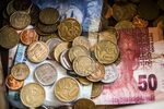 Rand coins and banknotes sit in a cash box in Johannesburg, South Africa, on Wednesday, Aug. 26, 2015. More than four years of currency declines -- to a fresh low this week -- aren't enough to offset electricity shortages, strikes and slowing demand from Asia and Europe that are pushing the economy to the brink of recession.
