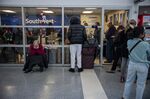 Travelers wait outside the Southwest Airlines baggage office at Oakland International Airport in Oakland, California, US, on Dec. 28.