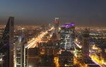 Light trails from automobile traffic traveling along the King Fahd highway, left, and Olaya Street, right, lead towards the Kingdom Tower, center rear, in Riyadh, Saudi Arabia, on Thursday, Dec. 1, 2016. Saudi Arabia is working to reduce the Middle East’s biggest economy’s reliance on oil, which provides three-quarters of government revenue, as part of a plan for the biggest economic shakeup since the country’s founding.
