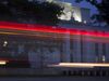 The Marriner S. Eccles Federal Reserve building stands past passing vehicles in this photograph taken with a tilt-shift lens in Washington, D.C.