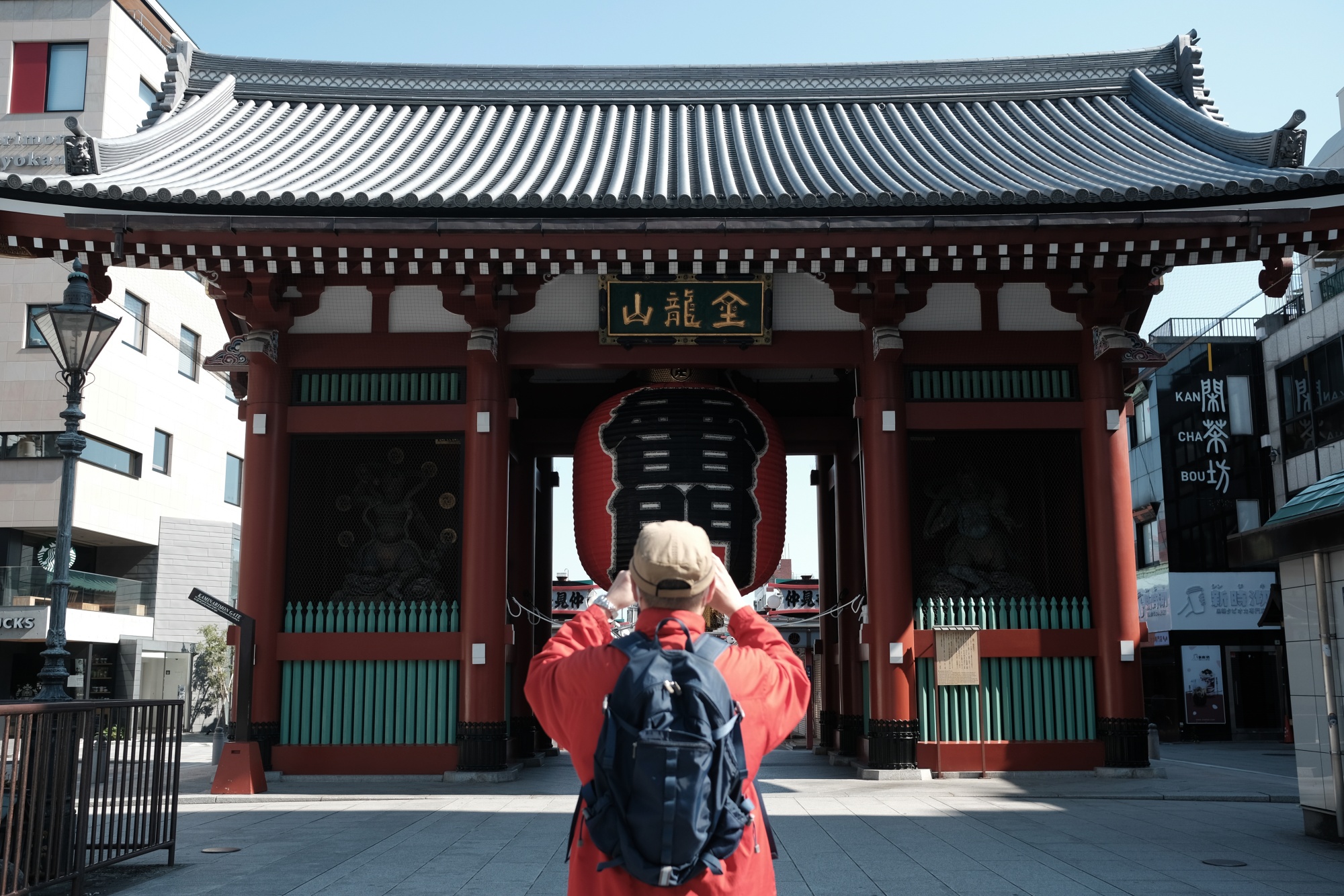 A person takes a photograph of a Kaminarimon gate near the Sensoji temple in the Asakusa district of Tokyo, on April 25.