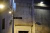 A Wall Street sign is displayed near the New York Stock Exchange (NYSE) in New York, U.S., on Thursday, Dec. 27, 2018. Volatility returned to U.S. markets, with stocks tumbling back toward a bear market after the biggest rally in nearly a decade evaporates.