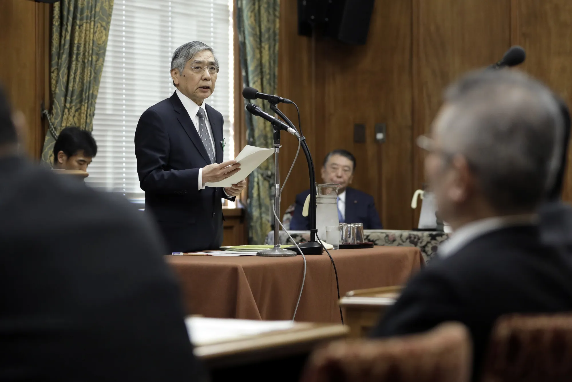 Haruhiko Kuroda, governor of the Bank of Japan (BOJ), speaks during a confirmation hearing for another term as central bank governor at a lower house of parliament in Tokyo, Japan, on Friday, March 2, 2018. The BOJ will start thinking about how to exit its massive monetary stimulus program in around the fiscal year starting in April 2019, Kuroda said.