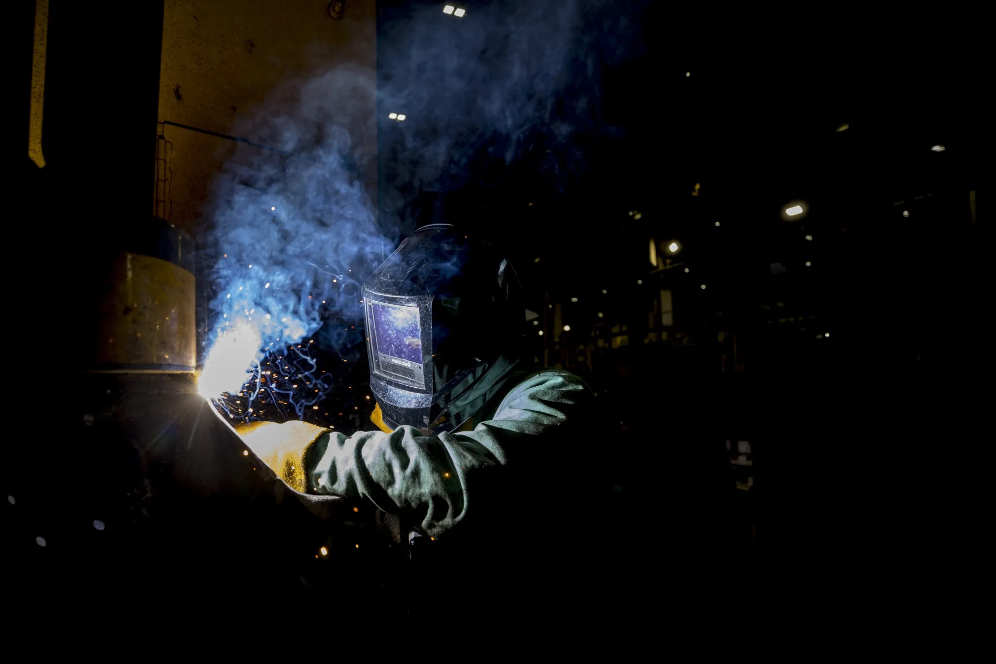 A welder works on a locomotive engine in Waycross, Georgia.