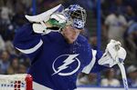 Tampa Bay Lightning goaltender Andrei Vasilevskiy (88) sprays water on his face during a timeout against the Florida Panthers during the third period in Game 4 of an NHL hockey second-round playoff series Monday, May 23, 2022, in Tampa, Fla. (AP Photo/Chris O'Meara)